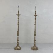 A pair of heavy 19th century style silver plated standard lamps each having a turned baluster form
