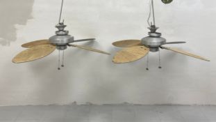 A pair of vintage Hunter ceiling fans. H.53 W.140cm