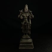 A 19th century or earlier Indian bronze figural statue depicting the Hindu deity Vishnu with four