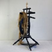 A 19th century turned and ebonised spinning wheel with carved bone embellishments. H.75cm