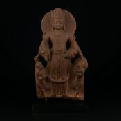 An Indian red sandstone figural carving of Vishnu standing in Samapada wearing long garlands,