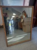 A simple rectangular mirror in a moulded pine frame. 106x80cm