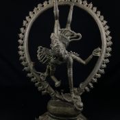 A 19th century Indian bronze figural statue depicting the Hindu god Shiva in a contorted position