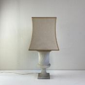 An early 20th century carved alabaster urn shaped table lamp having a flared rim over a lobed body