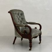 A 19th century Willian IV mahogany open armchair having a scrolled button back with carved arms