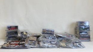 A collection of nineteen James Bond 007 Car Collection boxed die cast model cars with accompanying