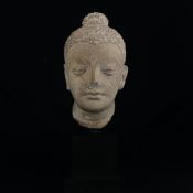 An Indian possibly Gupta period sculpted terracotta figural bust or head raised on a museum style