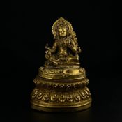 A 19th century Tibetan gilt bronze bodhisattva depicting a seated Tara or Jetsun Dolma on a double