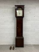 A 19th century mahogany longcase clock having a square top over an arched aperture with a square