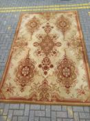 A large Afghan style Zielger carpet having central scrolling medallion surrounded by four others
