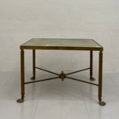 A 20th century French style side table having a square faux onyx top raised on four reeded