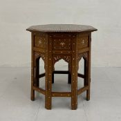 A vintage Anglo-Indian hardwood side table in two parts having an octagonal top inlaid with