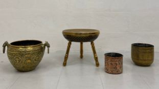 A 19th century Indian Raj period brass jardiniere having a globular body with a rolled rim decorated
