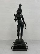 A large and impressive possibly 19th century Indian figural patinated bronze statue depicting the
