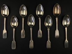 A matched set of eight 18th century and later silver hallmarked fiddle pattern dessert spoons by