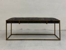 A vintage Hanbel bench model KN222 having a distressed leather buttoned seat set into a simple
