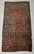 A 19th century Mahal carpet having all-over scrolling foliate decoration over an iron-red abrash
