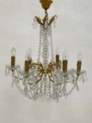 A 19th century French chandelier having a central reeded glass baluster form stem with gilt metal