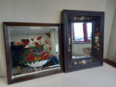An early 20th century wall hanging mirror with a bevelled plate hand painted with a still life