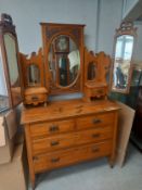 A 19th century satin walnut dressing table having a shaped and carved superstructure flanked by a