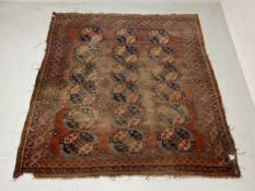 A 19th century Tekke carpet having three rows of six guls over an iron-red abrash ground within
