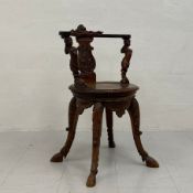 A 19th century Italian Renaissance style walnut armchair having a flat carved and shaped top rail
