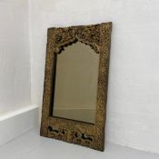An Indian carved gilt-wood mirror having a matched rectangular plate set into a 19th century
