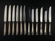 Two sets of six knives with silver hallmarked handles to include a Sheffield 205 set with faceted