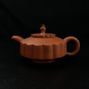 A contemporary Chinese Yixing Peacock teapot of squat and stylised chrysanthemum form in the