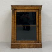 A 19th century walnut dwarf pier cabinet having a thumb-moulded top with a crossbanded and marquetry
