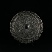 A 19th century Indian white metal Kutch silver tray or platter having a central circular convex