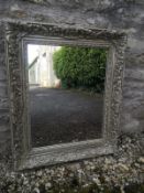 A contemporary painted wall mirror in the French 19th century style having a rectangular plate in