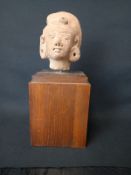 A possibly 13th century Majapahit period Javanese red sandstone or terracotta bust raised on a
