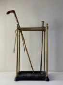 A C.1900 stick stand having a tubular brass superstructure with a gridded top and turned finials