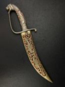 A 20th century Indian Sikh Rajput Kirpan knife or dagger having a pierced handle with lion's head