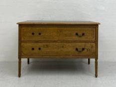 An early 20th century French provincial oak commode chest having a rectangular top over two long