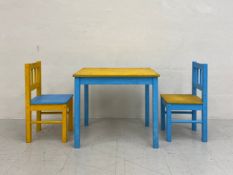 A vintage children's blue and yellow painted table and chairs. H.50 W.59 D.50cm