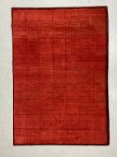 A vintage Gabbeh style carpet having a linework grid with a geometric patterned band in black over a