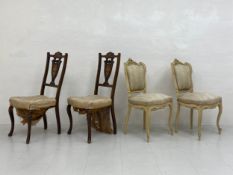 A pair of 19th century marquetry inlaid mahogany dining chairs each having a shaped back and splat