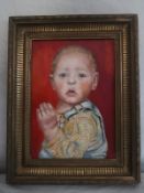 A contemporary oil on canvas, portrait of a baby in a fluted gilt frame. 48x38cm