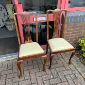 A pair of Edwardian mahogany side chairs.