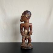 A Central African figural Luba or ancestor wood carving from the Democratic Republic of the Congo