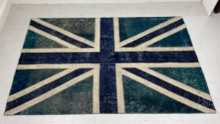 A contemporary Union Jack carpet having a blue and green field over an off white ground. L.290 W.