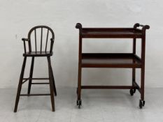 A 19th century child's oak stick-back highchair along with a 20th century mahogany two tier tray-top