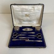 A hallmarked silver part manicure set by Charles S. Green & Co Ltd, Birmingham 1944 in a fitted