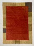 A vintage hand-knotted carpet having a burgundy abrash field within an abstract geometric border
