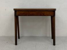 A 19th century oak tea table table having a square hinged fold-over top with curved corners raised