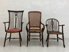 A C.1900 Arts and Crafts Windsor armchair having a shaped and spindled back with scrolled arms