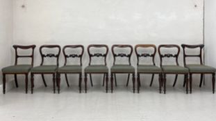 A set of six 19th century rosewood balloon back dining chairs each having a curved top rail with a