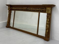 A 19th century William IV triptych overmantel mirror having a moulded breakfront cornice with a